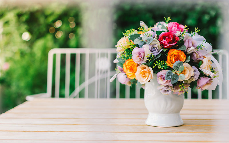 Colourful flower bouquet centerpiece on an outdoor table