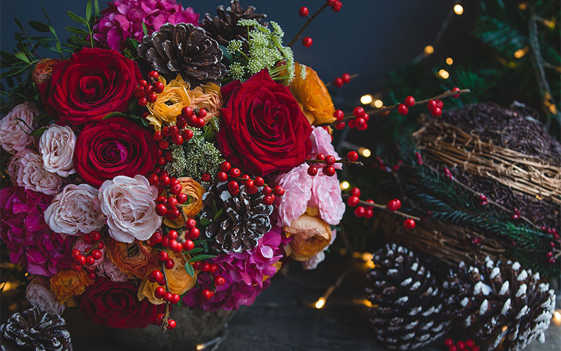 D'Spring florist curating a winter seasonal flower collection bouquet.